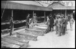 Temporary morgue in Queenstown<br>



                of the Lusitania victims.